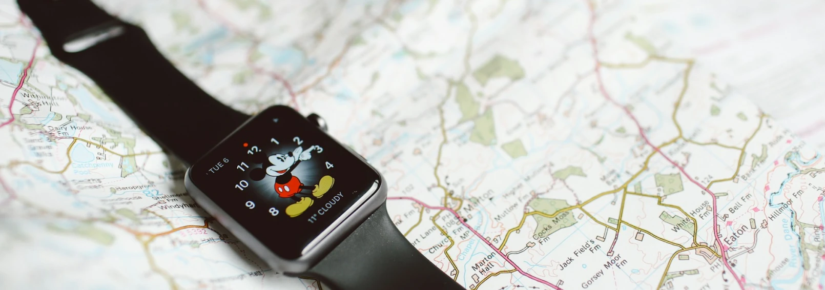 An Apple Watch laying on a map